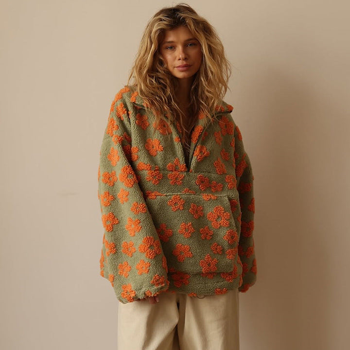 Cozy women's floral print fleece pullover. Soft sherpa top for relaxed fall style.