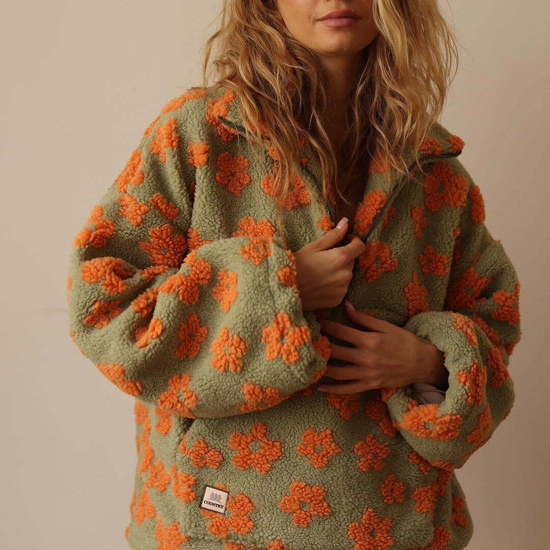 Soft women's floral fleece sherpa top, oversized pullover for cozy fall fashion & comfort.