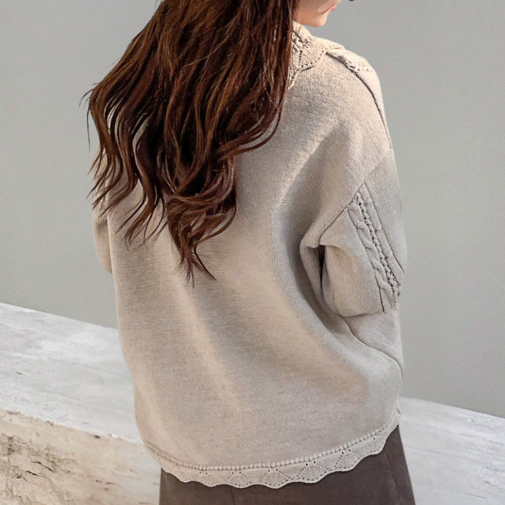 Elegant women's knitted floral sweater. This chic long-sleeve pullover offers cozy comfort for fall/winter.