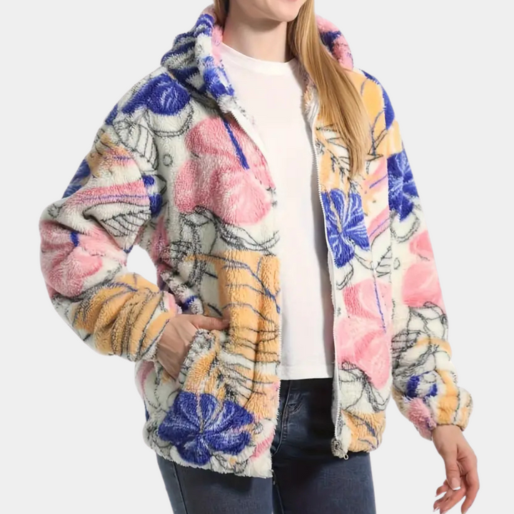 Cozy women's pink floral hooded coat. Warm winter jacket featuring a beautiful print for elegant outdoor wear.