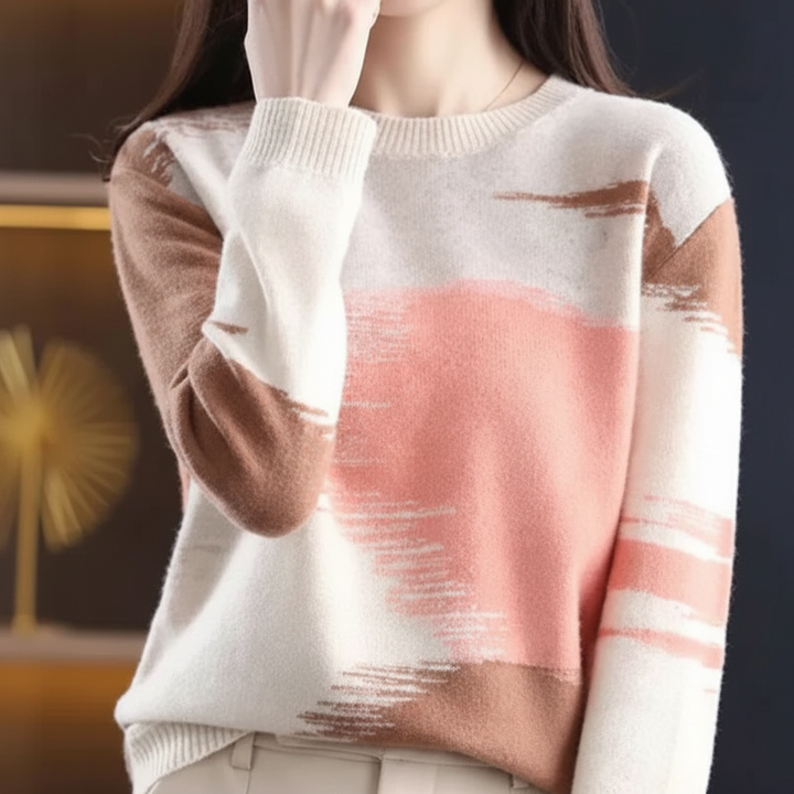 Close-up of a women's gradient knitwear sweater, showcasing soft texture and round neckline