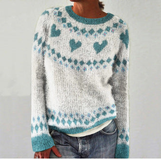 Women's cozy heart print knit jumper. Relaxed fit long sleeve sweater for casual winter comfort.