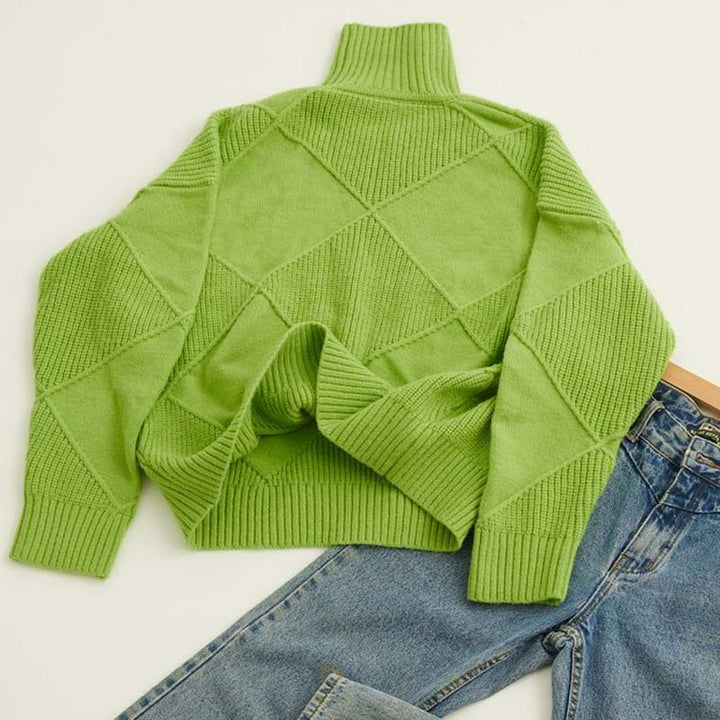 Detailed view of the knit pattern on a women's high-collar cozy sweater.
