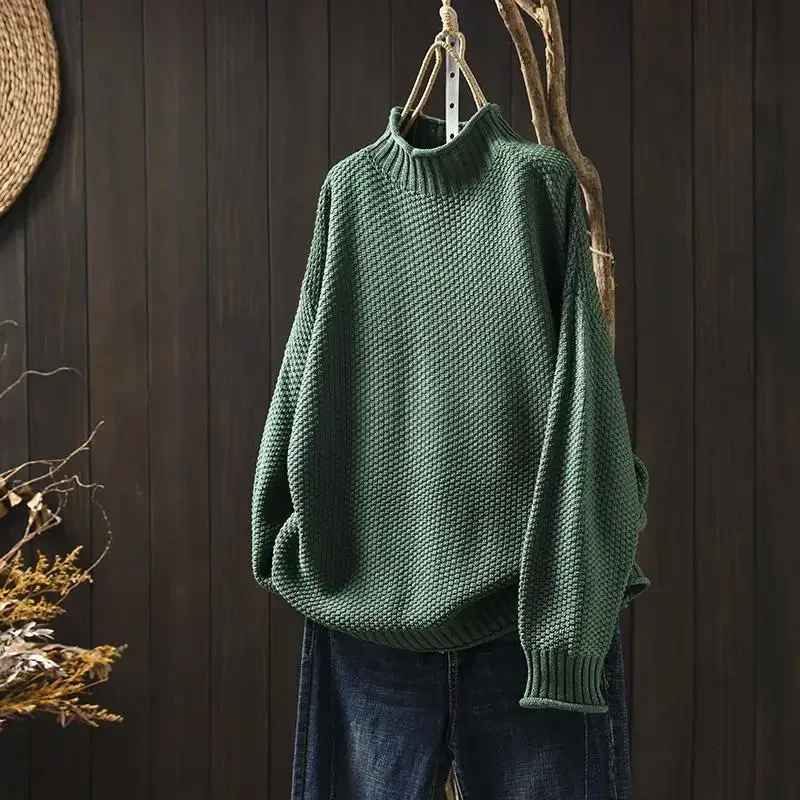 Sophisticated women's knitwear, a relaxed fit honeycomb pullover with turtleneck.