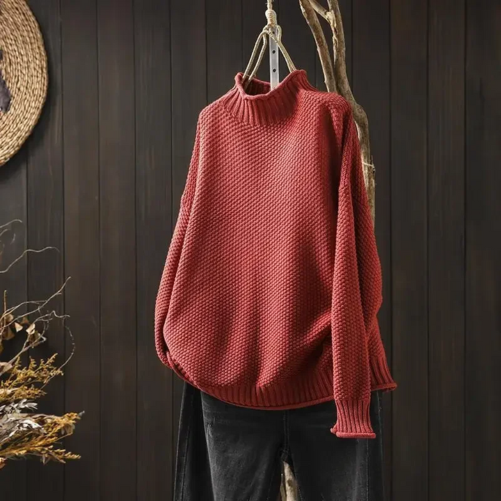 Stylish women's turtleneck sweater in a soft honeycomb knit, ideal for winter fashion.