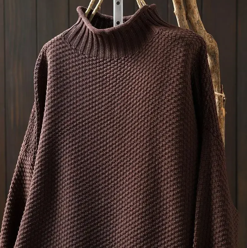 Women's winter fashion honeycomb knit pullover, offering warmth and style.