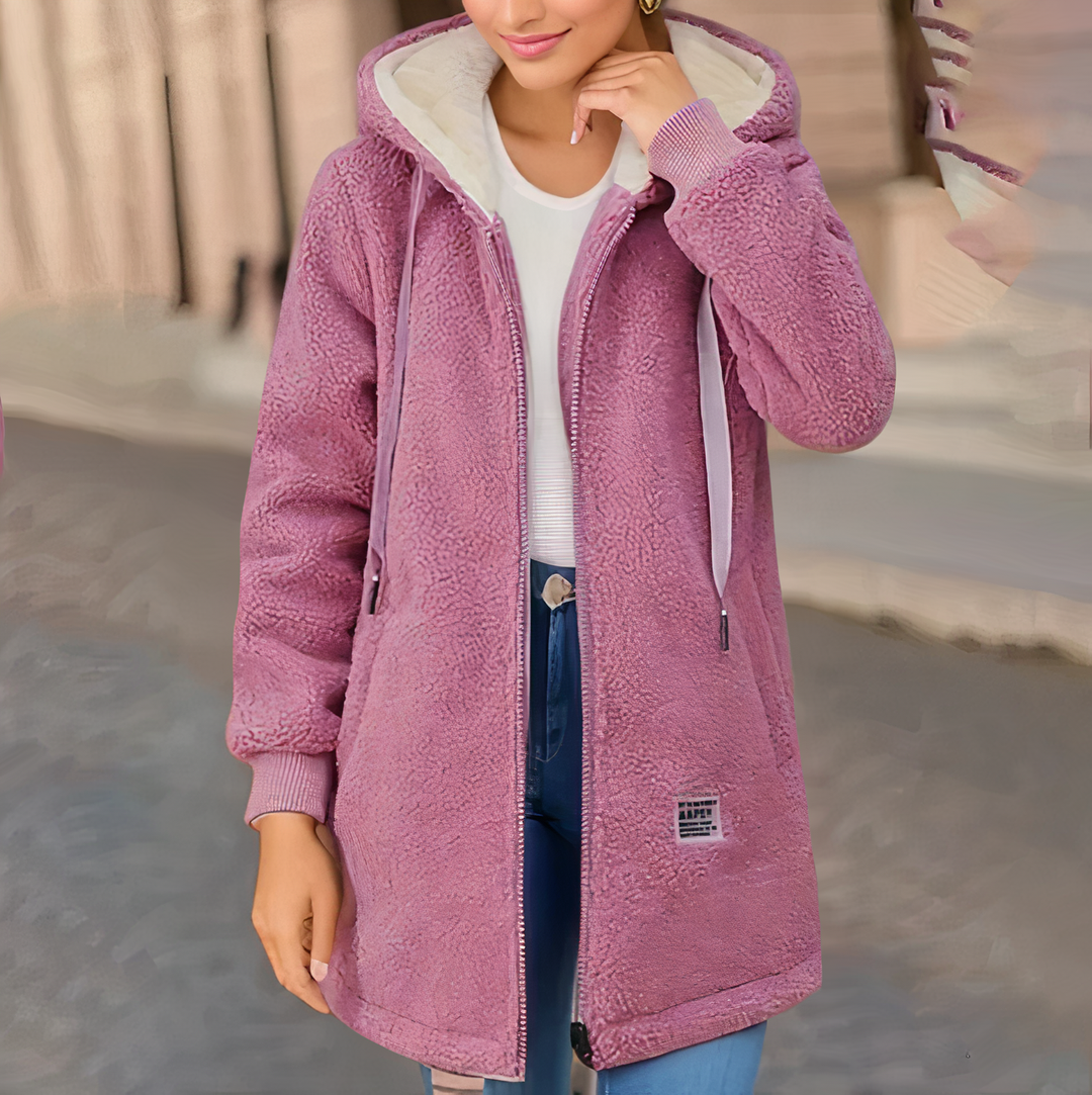 Women's cozy hooded fleece winter jacket in a stylish color. Perfect warm casual outerwear for chilly days.