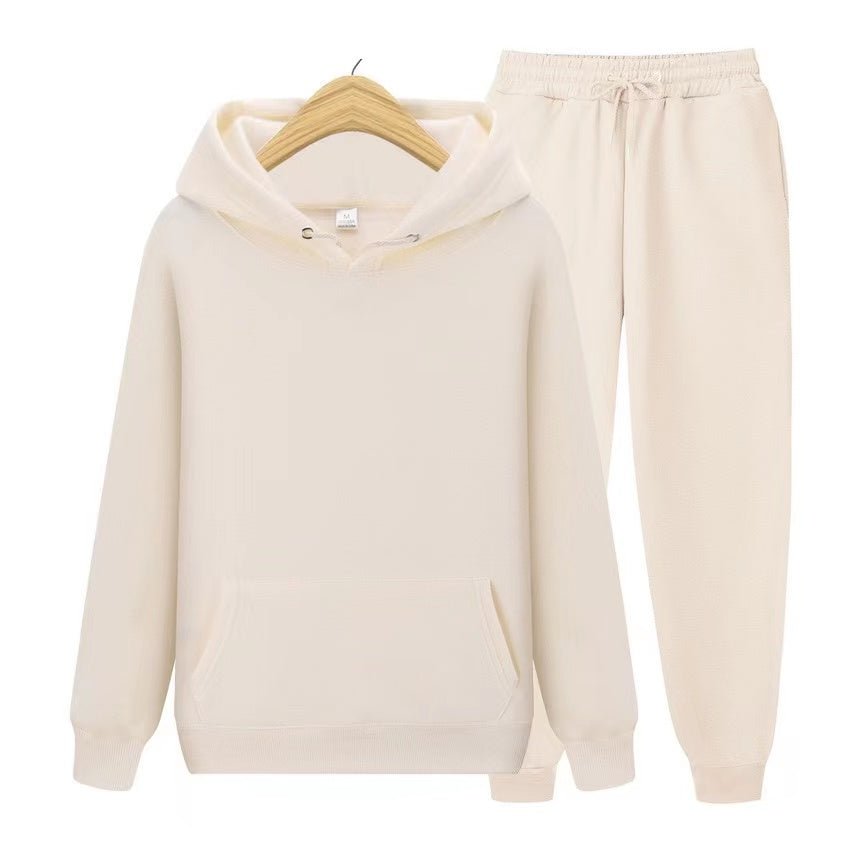 Fashionable women's hooded sweatshirt & jogger set. Relaxed fit twopiece for casual comfort, lounge, & activewear.