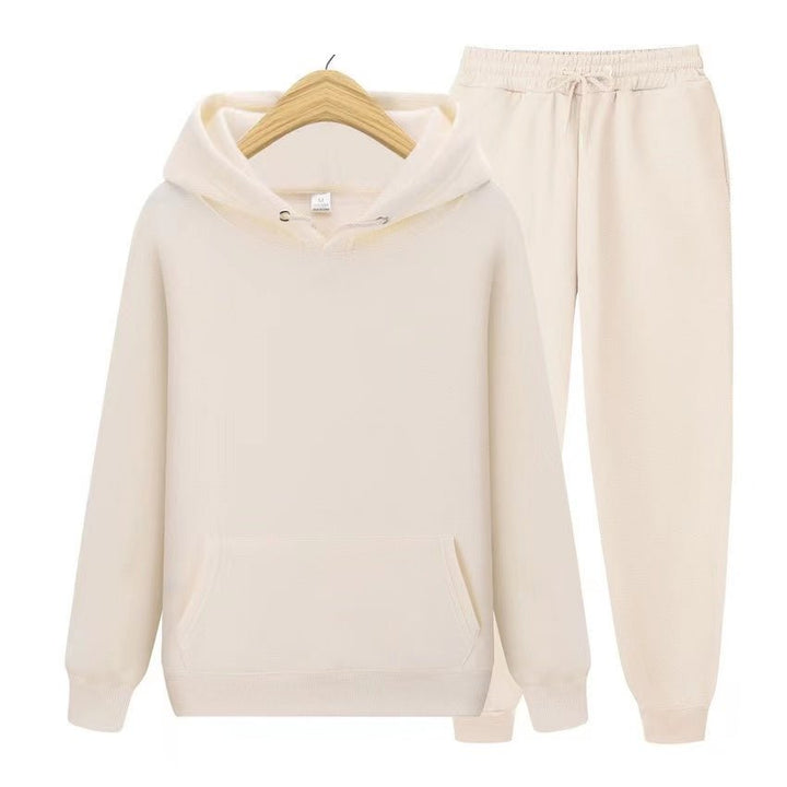 Fashionable women's hooded sweatshirt & jogger set. Relaxed fit twopiece for casual comfort, lounge, & activewear.