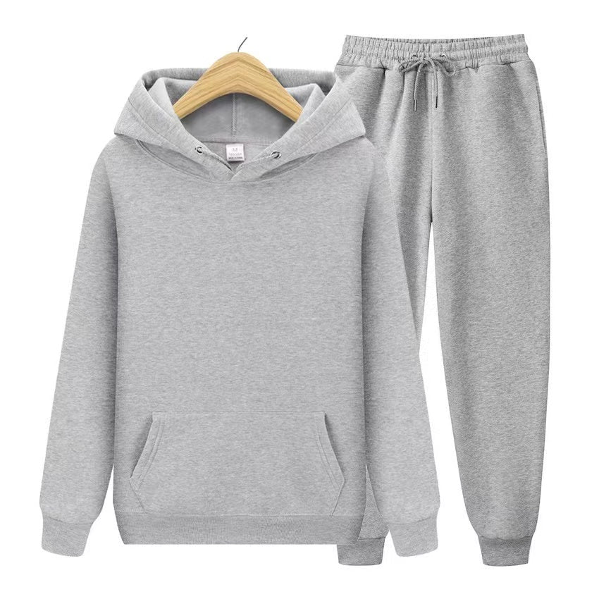 Sporty women's hooded sweatshirt & jogger set. Relaxed fit twopiece ideal for travel, activewear & daily comfort.