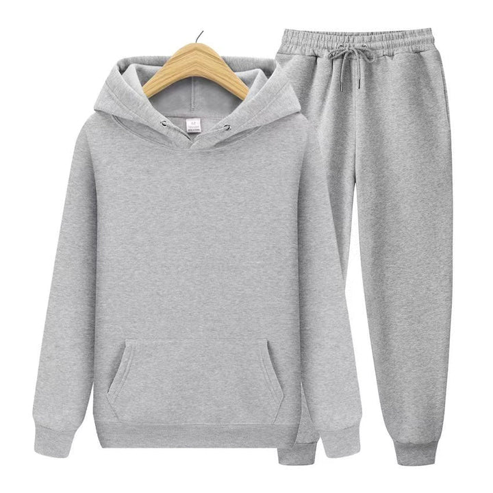 Sporty women's hooded sweatshirt & jogger set. Relaxed fit twopiece ideal for travel, activewear & daily comfort.