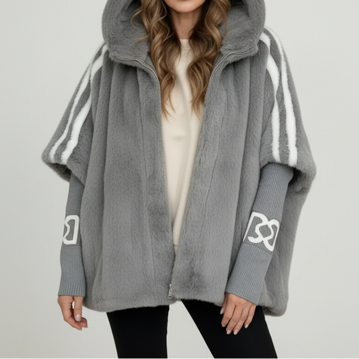 Fashionable women's winter jacket with a hood, a warm and practical parka for stylish cold weather outfits.