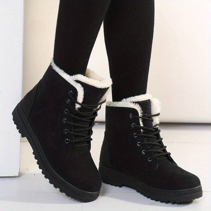 Women's cozy insulated winter boots, perfect for snow & cold weather. Stay warm & stylish with comfortable ankle footwear.