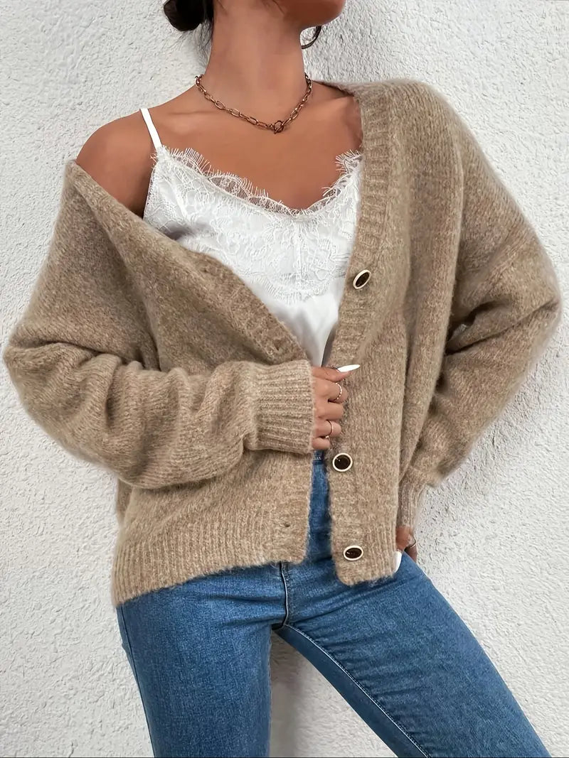 Stylish women's khaki long-sleeve knitted sweater. Versatile casual top, ideal for fall and winter wear.