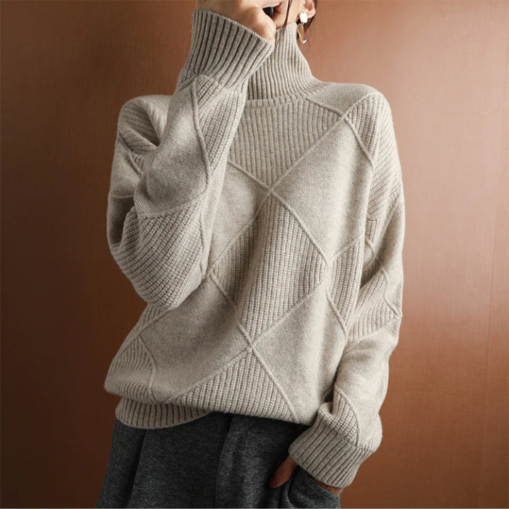 Women's warm sweater with a cozy knit turtleneck design. Effortless style pullover.