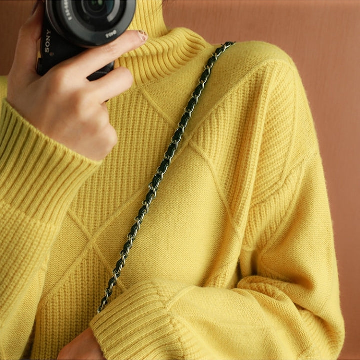 Elegant women's turtleneck pullover. Long sleeve and cozy knit for autumn wear.