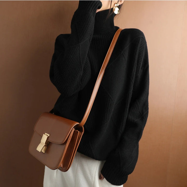 Soft women's long sleeve turtleneck sweater. Cozy knit pullover for effortless style.