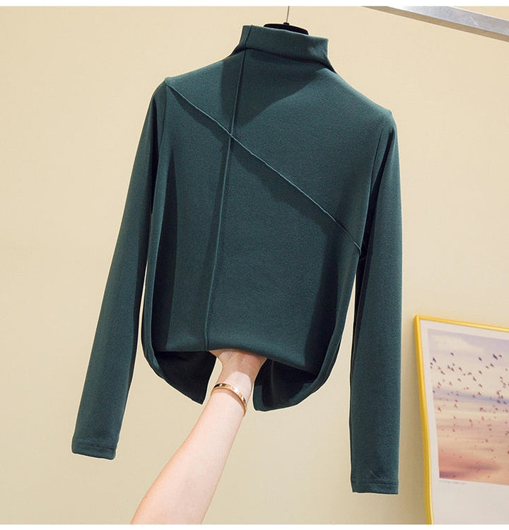 Soft knit turtleneck top for women, a versatile long-sleeve layering piece for cold weather.