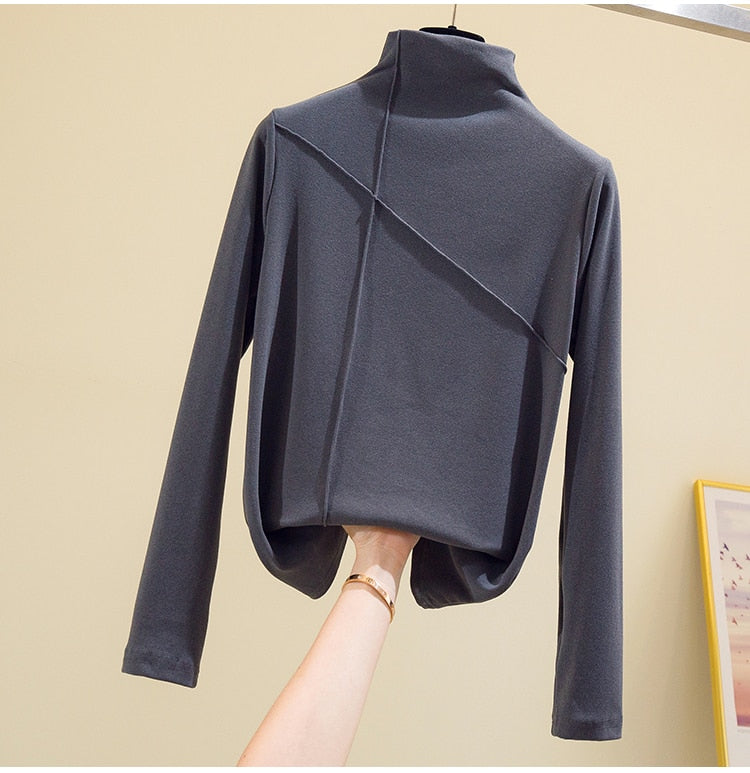 Warm women's knit turtleneck sweater, great for layering and achieving an effortless casual look.