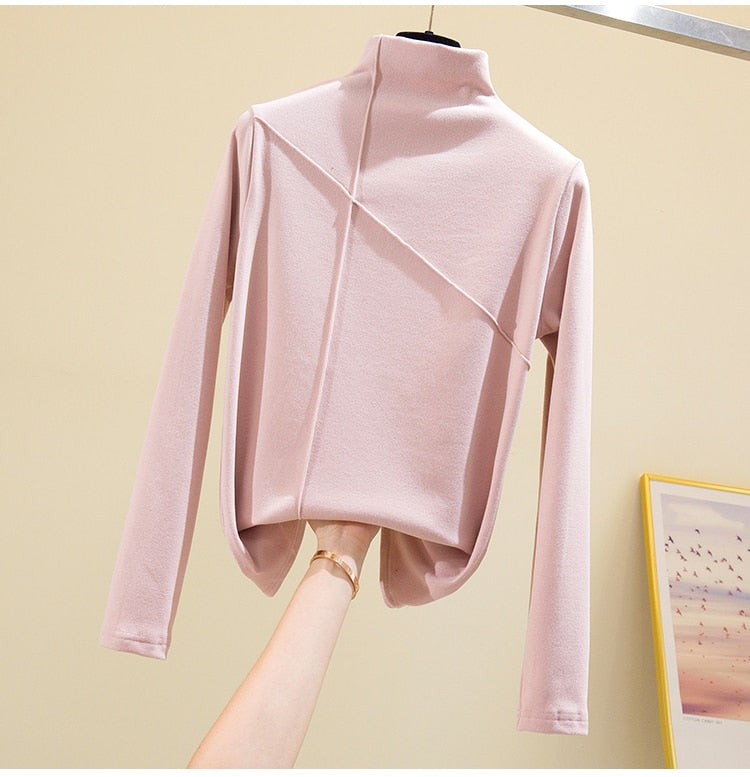 Women's comfortable high-neck knit top, an essential long-sleeve sweater for winter wear.