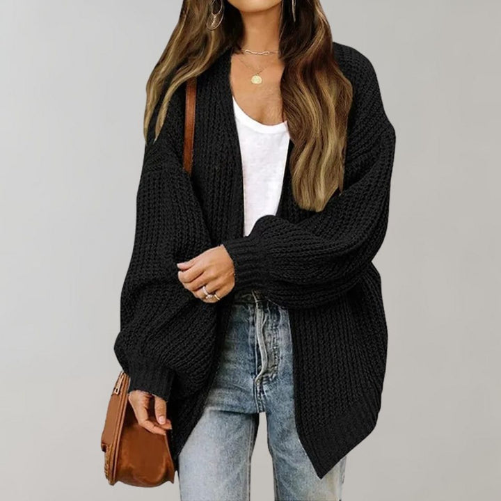 Women's cozy knitted cardigan in a versatile style, perfect for autumn layering and comfort.