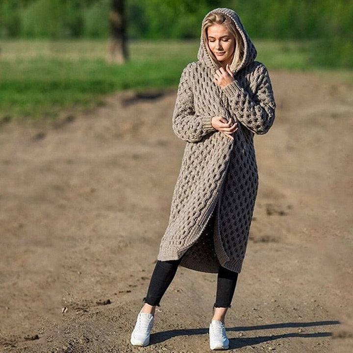 Warm & soft women's knitted hooded cardigan with pockets. Ideal for cozy winter wear and everyday comfort.