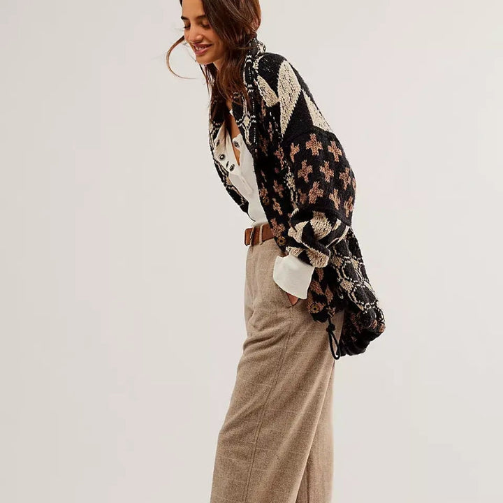 Knitted women's oversized cardigan with a stylish geometric pattern. Cozy and comfortable.
