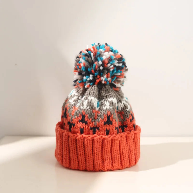 Warm women's casual winter hat with an elegant snowflake motif & a playful pom-pom.