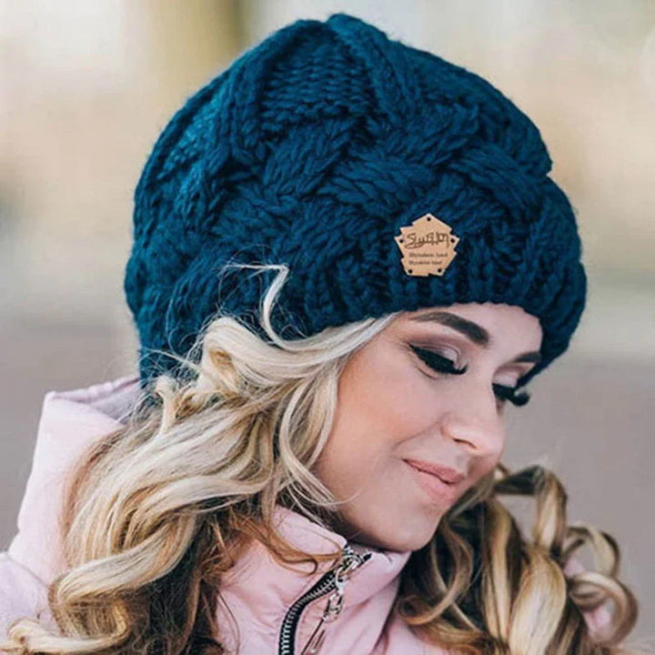 Warm women's knitted winter hat, ideal for keeping cozy and stylish during cold weather activities.