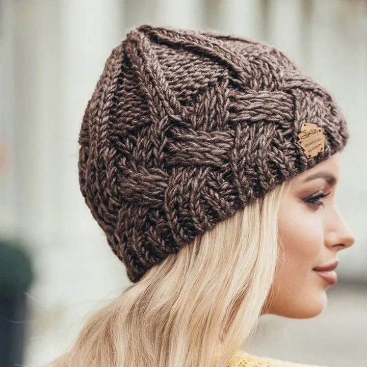 Chic women's knitted winter hat, a comfortable and warm beanie accessory for everyday style.
