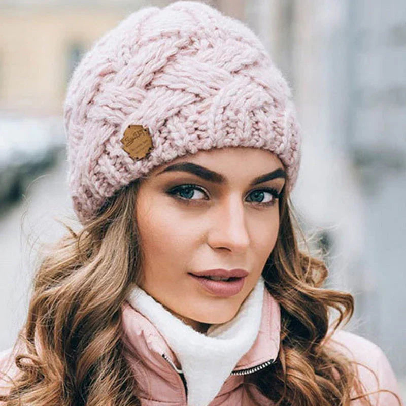 Plush, comfortable women's knitted winter beanie hat, ensuring ultimate warmth and coziness.