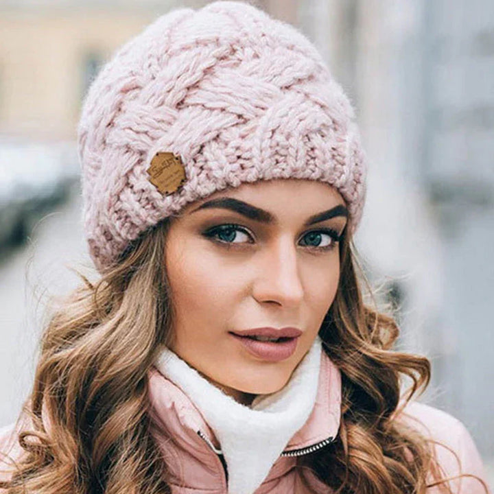 Plush, comfortable women's knitted winter beanie hat, ensuring ultimate warmth and coziness.