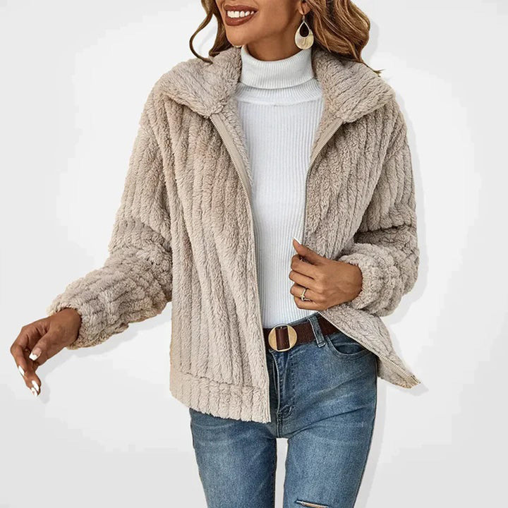 Stylish women's long fleece cardigan vest, soft & warm for comfortable layering in cold weather.