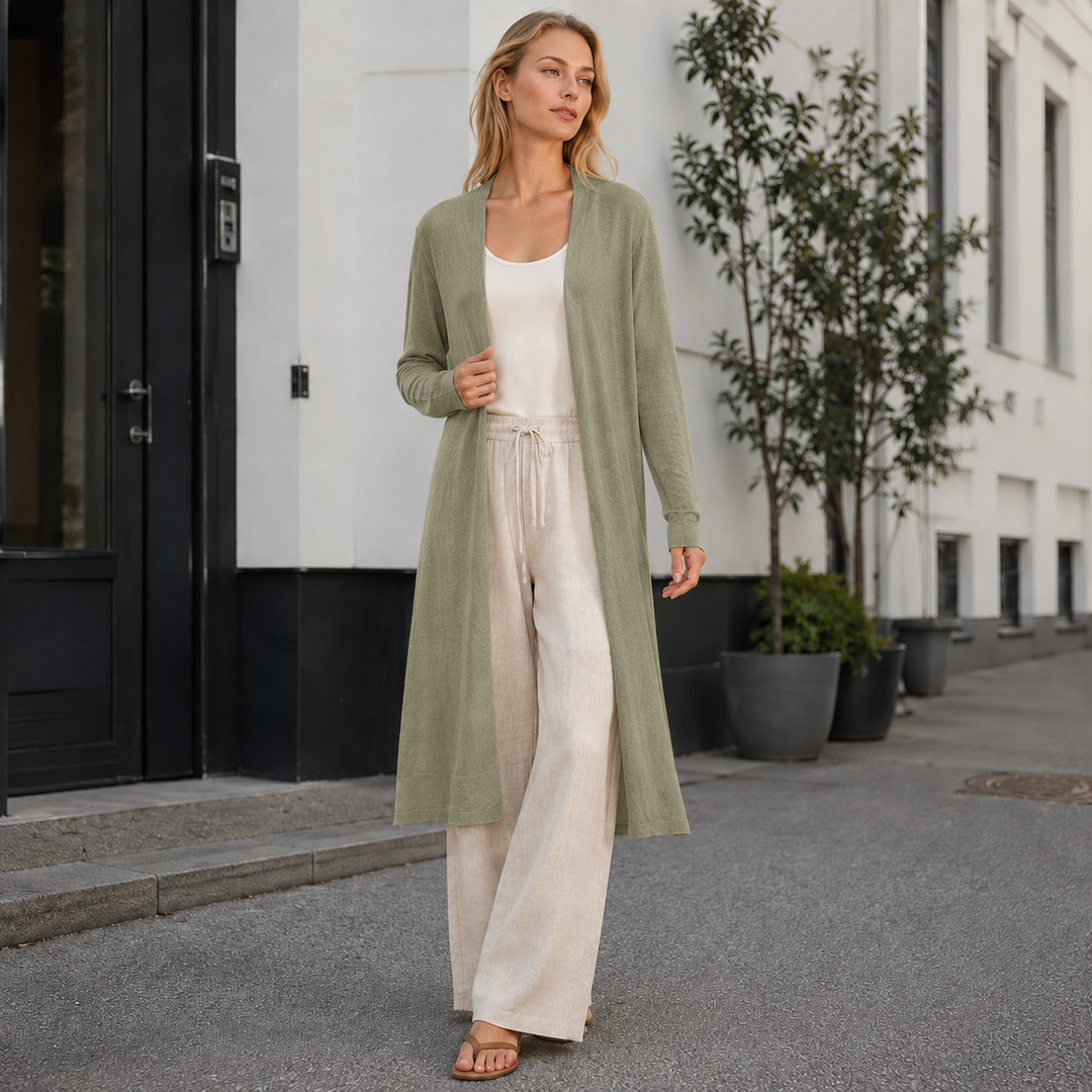 Warm & cozy women's knit cardigan. Long design offers comfort for autumn/winter fashion.