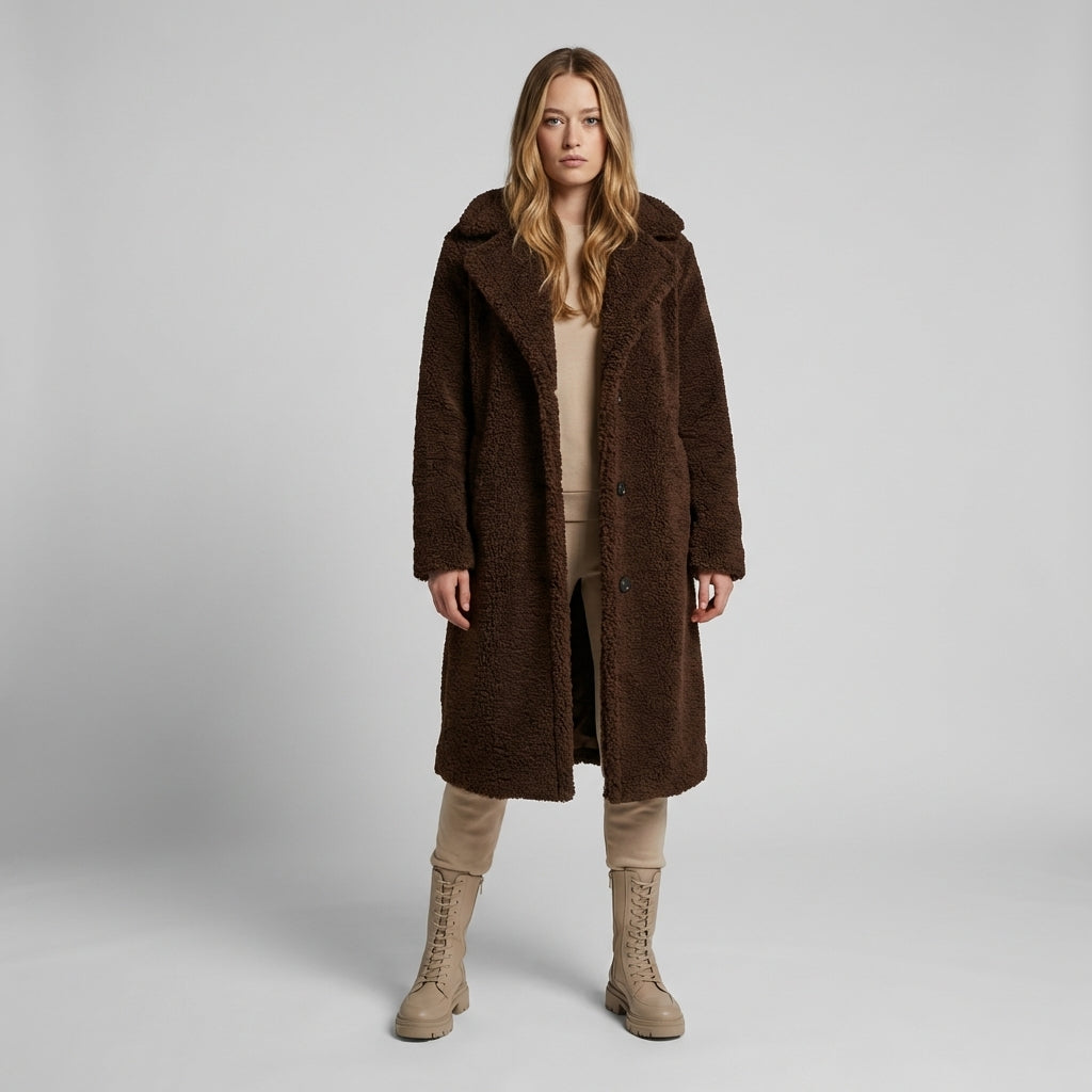 Women's cozy longline teddy coat in a soft brown hue, perfect for chic winter fashion & warmth.