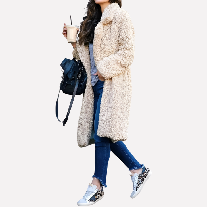 Fashionable women's longline teddy coat with elegant notched collar & soft fabric. Ideal winter jacket.