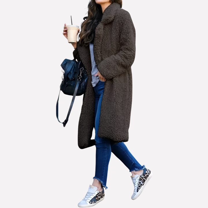 Plush women's teddy longline coat, super soft & warm. Chic winter outerwear with a sophisticated notched collar.