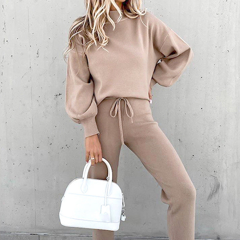 Woman relaxing in a soft & cozy women's loungewear set, perfect for home comfort.