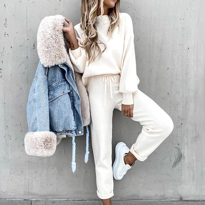 Woman wearing a stylish & cozy two-piece loungewear set for ultimate relaxation.