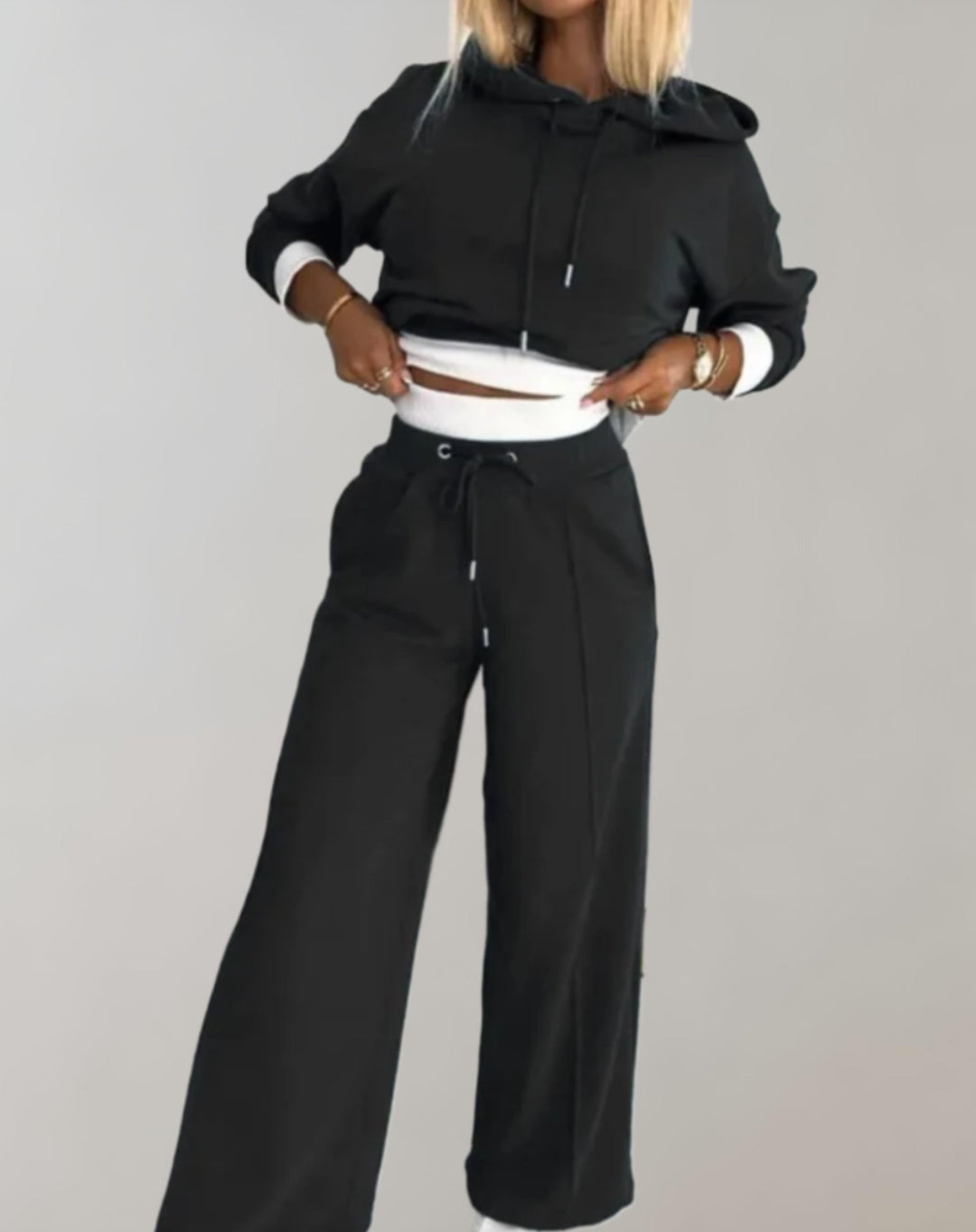 Soft women's loungewear set: a comfy hooded top and wide leg pants for a relaxing and stylish casual look.