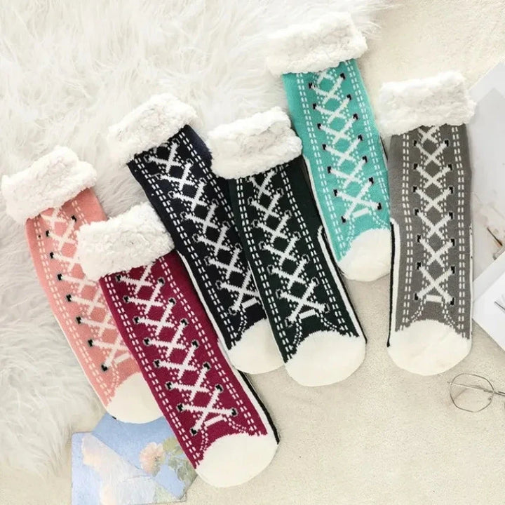 Soft and cozy women's no-show sneaker socks, offering comfortable footwear with a discreet, invisible look.