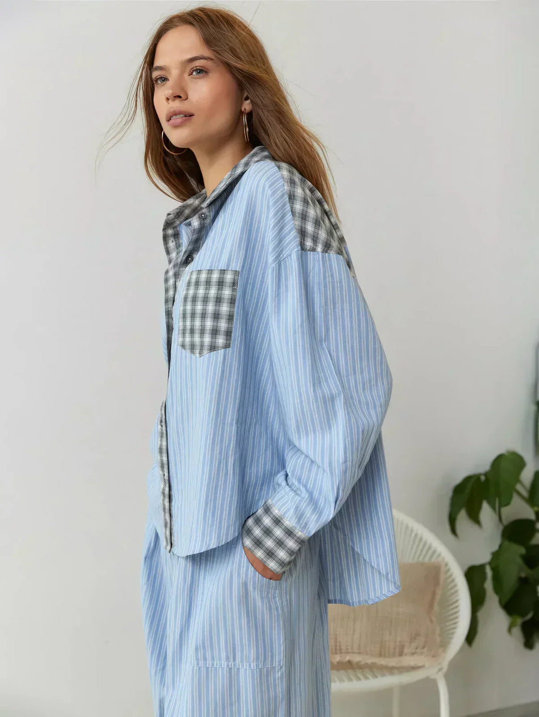 Soft women's plaid sleepwear set. Button-up long-sleeve top & relaxed fit pants ensure cozy comfort all night.