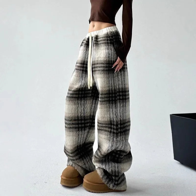 Women's cozy plaid lounge trousers with a relaxed wide-leg fit for ultimate comfort and casual style.