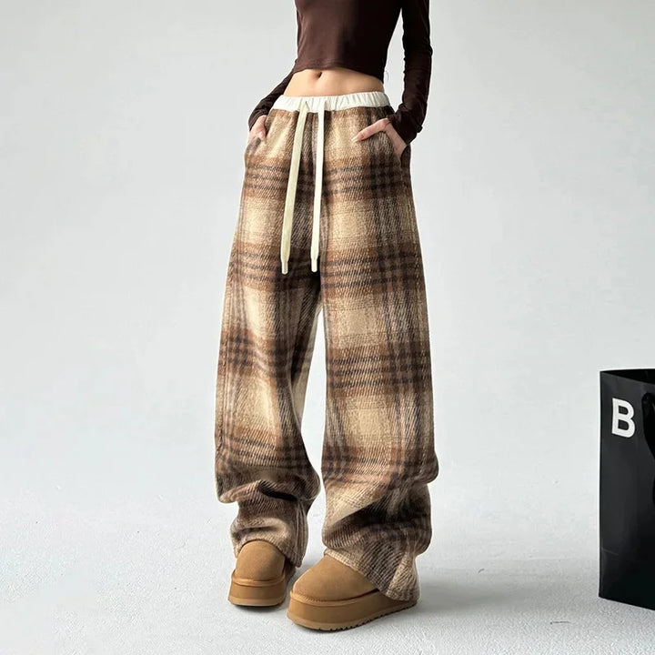 Relaxed fit women's plaid wide-leg trousers, offering cozy comfort for casual fashion bottoms.