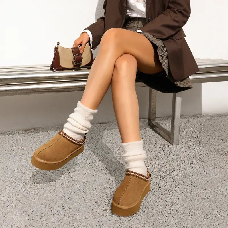Trendy platform house slippers for women, featuring a durable sole & cozy design.