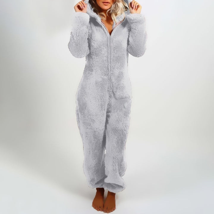 Soft women's plush hooded onesie, ideal for winter lounging. Features a comfy hood and full-body warmth.