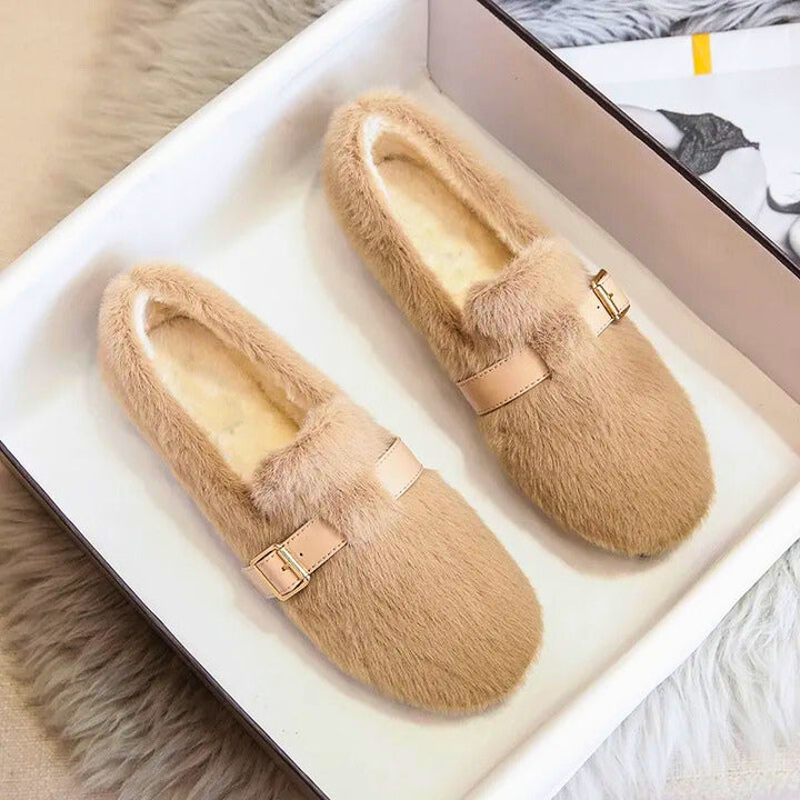 Women's cozy plush-lined slip-on flats in a neutral tone, offering cloud-like comfort for casual everyday style.