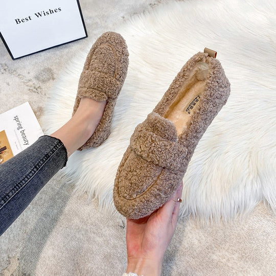 Women's cozy plush loafer slippers in a comfortable, soft material, perfect for indoor home comfort.