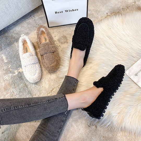 Comfortable women's indoor house slippers, featuring a cozy plush loafer design for relaxed home wear.
