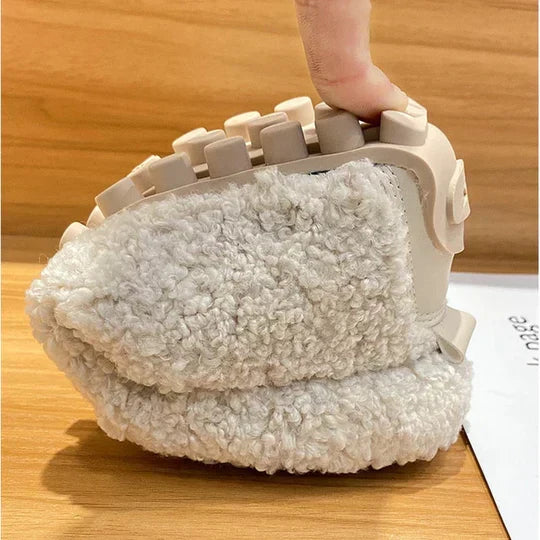 Women's cozy plush loafer slippers on feet, illustrating the ultimate comfort for relaxed home leisure.